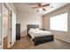 Cozy bedroom with a double bed, ceiling fan, and window coverings at 8152 Satin Carnation Ln, Las Vegas, NV 89166