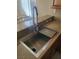 Modern stainless steel kitchen sink with a pull-down faucet and a built-in drying rack at 8152 Satin Carnation Ln, Las Vegas, NV 89166