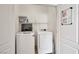 Laundry room with washer, dryer, and storage shelves at 8152 Satin Carnation Ln, Las Vegas, NV 89166