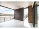 Large outdoor balcony offering scenic views and modern railing at 3690 S Spring Mountain Blvd, Pahrump, NV 89048