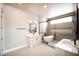 Modern bathroom featuring dual vanities, soaking tub, and walk-in shower at 3690 S Spring Mountain Blvd, Pahrump, NV 89048