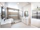 Bathroom showcasing a soaking tub, walk-in shower, and dual sinks at 3690 S Spring Mountain Blvd, Pahrump, NV 89048