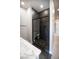 Stylish bathroom with a black-tiled walk-in shower, sleek fixtures, and modern design at 3690 S Spring Mountain Blvd, Pahrump, NV 89048