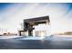 Modern two-story home with a dark accent block, a two-car garage, and desert landscaping at 3690 S Spring Mountain Blvd, Pahrump, NV 89048