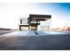 Stunning two-story modern home featuring a minimalist design with clean lines and desert landscaping at 3690 S Spring Mountain Blvd, Pahrump, NV 89048