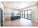 Bright, modern kitchen with a large island, stainless steel appliances, and sliding doors to the outside at 3690 S Spring Mountain Blvd, Pahrump, NV 89048