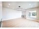 Bright living room with modern lighting, sleek floors, and an open floor plan at 3690 S Spring Mountain Blvd, Pahrump, NV 89048