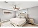 Spacious bedroom with plush bedding and ceiling fan at 1707 S 8Th St, Las Vegas, NV 89104