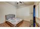 Bright bedroom featuring wood flooring, vaulted ceiling, and large windows with natural light at 2035 E Warm Springs Rd # 1019, Las Vegas, NV 89119