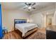Spacious bedroom with wood floors, ceiling fan, recessed lighting, and a view into the ensuite at 2035 E Warm Springs Rd # 1019, Las Vegas, NV 89119