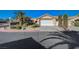 Charming single-story home with a well-manicured yard, desert landscaping, and a two-car garage at 2035 E Warm Springs Rd # 1019, Las Vegas, NV 89119