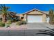 Inviting single-Gathering home showcasing desert landscaping and a two-car garage at 2035 E Warm Springs Rd # 1019, Las Vegas, NV 89119