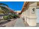 Attractive home featuring a well-maintained lawn and a charming walkway leading to the front door at 2035 E Warm Springs Rd # 1019, Las Vegas, NV 89119