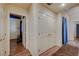 Well-lit hallway featuring hardwood floors and lots of storage space at 2035 E Warm Springs Rd # 1019, Las Vegas, NV 89119