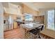 Eat-in kitchen with modern stainless steel appliances, granite counters, and breakfast bar at 2035 E Warm Springs Rd # 1019, Las Vegas, NV 89119