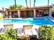 Inviting pool area with lounge chairs, hot tub and shaded seating for relaxing by the water at 2035 E Warm Springs Rd # 1019, Las Vegas, NV 89119