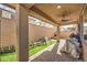 Covered patio with artificial turf and fire pit at 398 Espressivo St, Henderson, NV 89011