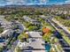 Aerial view of house, pool, and surrounding community with mountain backdrop at 525 Summer Mesa Dr, Las Vegas, NV 89144