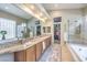 Elegant bathroom with granite countertops, double sinks, walk-in shower, and large soaking tub at 525 Summer Mesa Dr, Las Vegas, NV 89144