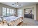Bright bedroom with sliding glass doors to backyard, featuring a plush bed and ample closet space at 525 Summer Mesa Dr, Las Vegas, NV 89144