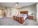 Spacious Primary bedroom with large bed, built-in shelving, and ensuite bathroom access at 525 Summer Mesa Dr, Las Vegas, NV 89144