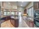 Large kitchen with island, granite counters and stainless steel appliances at 525 Summer Mesa Dr, Las Vegas, NV 89144