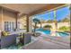 Relaxing patio overlooking the pool and landscape at 525 Summer Mesa Dr, Las Vegas, NV 89144