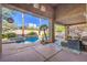 Inviting backyard oasis with a sparkling pool and comfortable patio furniture at 525 Summer Mesa Dr, Las Vegas, NV 89144
