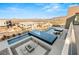Aerial view of a modern home featuring a luxury pool, spa, and outdoor fire pit area at 612 Dragon Mountain Ct, Henderson, NV 89012
