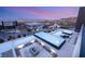 Aerial view of a modern home featuring a luxury pool, spa, and outdoor fire pit area at twilight at 612 Dragon Mountain Ct, Henderson, NV 89012