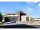Contemporary home featuring a clean architectural design, sleek lines, and a three-car garage at 612 Dragon Mountain Ct, Henderson, NV 89012