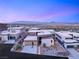Contemporary home exterior showcasing modern architecture, three-car garage, and desert landscaping with mountain views at 612 Dragon Mountain Ct, Henderson, NV 89012