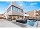 Contemporary home with an outdoor living area, pool, and modern design elements at 612 Dragon Mountain Ct, Henderson, NV 89012