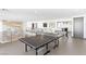 Upper level game room with ping pong and foosball tables is great for relaxation and fun at 612 Dragon Mountain Ct, Henderson, NV 89012