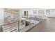 Open hallway with stylish stone accent wall and a view of a bright and airy living space at 612 Dragon Mountain Ct, Henderson, NV 89012