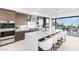Modern kitchen featuring a large island, stainless steel appliances, and seamless outdoor living access at 612 Dragon Mountain Ct, Henderson, NV 89012