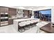 Well-appointed kitchen with an island, modern appliances, and seamless access to outdoor dining and living areas at 612 Dragon Mountain Ct, Henderson, NV 89012