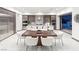Contemporary kitchen with stainless steel appliances, an island with seating, and a dining area at 612 Dragon Mountain Ct, Henderson, NV 89012
