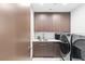 Well-equipped laundry room with modern appliances, ample storage, and sleek design at 612 Dragon Mountain Ct, Henderson, NV 89012