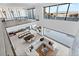 Spacious living room with an open floor plan, modern decor, and a view of the pool and mountains at 612 Dragon Mountain Ct, Henderson, NV 89012
