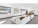 Stylish living room featuring modern furnishings, sleek windows with scenic views, and contemporary decor at 612 Dragon Mountain Ct, Henderson, NV 89012