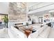 Open-concept living room with a grand fireplace, high ceilings, and stylish contemporary decor at 612 Dragon Mountain Ct, Henderson, NV 89012