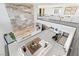 Stylish living room with high ceilings, modern fireplace, and open floor plan leading to the outdoors at 612 Dragon Mountain Ct, Henderson, NV 89012