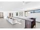 Bright and spacious living area with comfortable seating and modern bar, perfect for entertaining at 612 Dragon Mountain Ct, Henderson, NV 89012