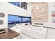 Bright, modern living room featuring a fireplace, high ceilings, and seamless indoor-outdoor living at 612 Dragon Mountain Ct, Henderson, NV 89012