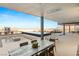 Expansive outdoor patio features a dining area, fire pit, and panoramic mountain views at 612 Dragon Mountain Ct, Henderson, NV 89012