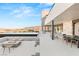 Beautiful outdoor patio with a fire pit, infinity pool, and breathtaking views at 612 Dragon Mountain Ct, Henderson, NV 89012