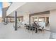 Extended patio with a dining table, seating, and easy access to indoor living spaces at 612 Dragon Mountain Ct, Henderson, NV 89012
