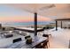 Inviting outdoor patio with dining area, fire pit, and stunning views, ideal for entertaining and relaxation at 612 Dragon Mountain Ct, Henderson, NV 89012