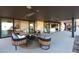 Modern patio with comfortable seating, outdoor fireplace, and seamless indoor-outdoor flow at 612 Dragon Mountain Ct, Henderson, NV 89012